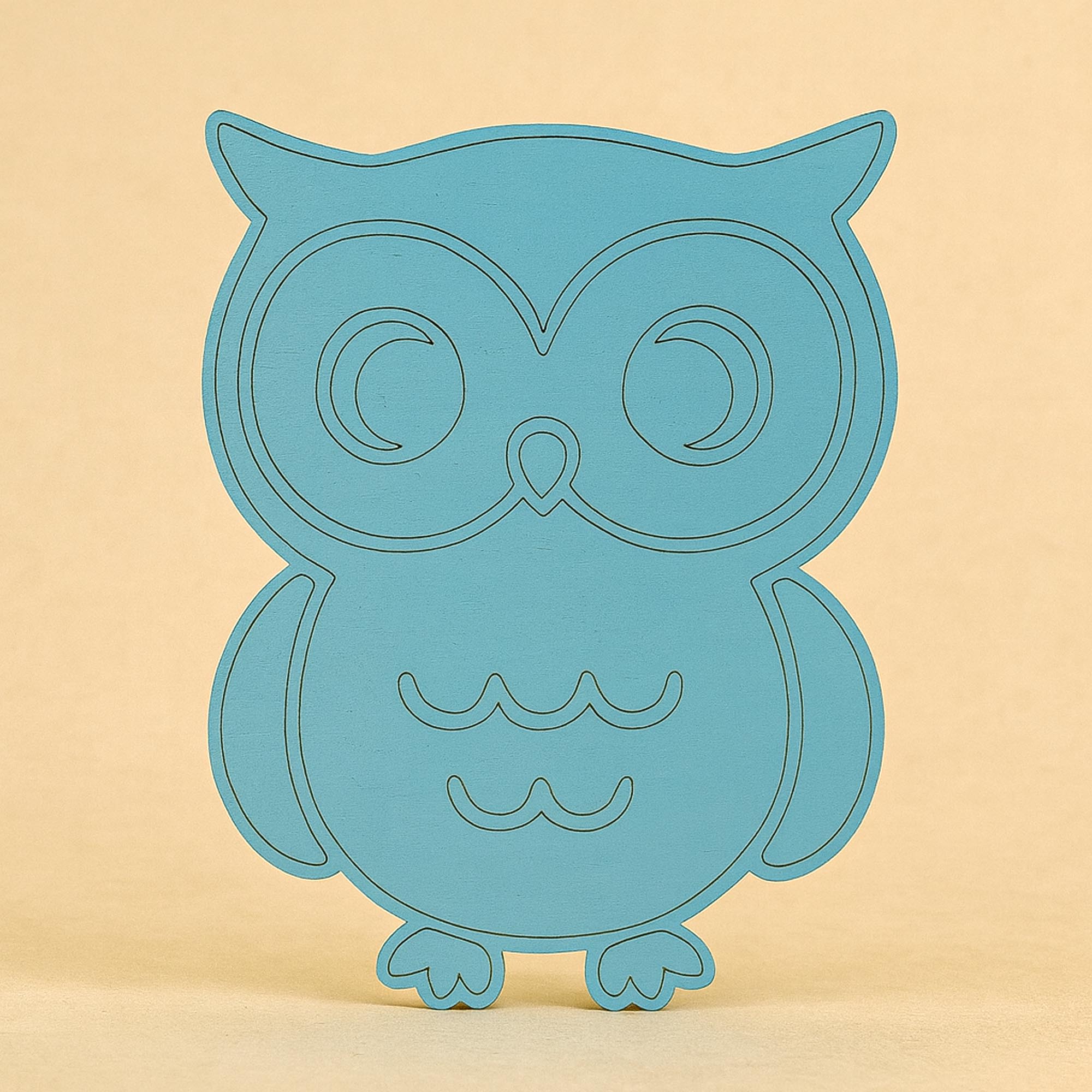 Puidust öökulli seinakaunistus lastetoas